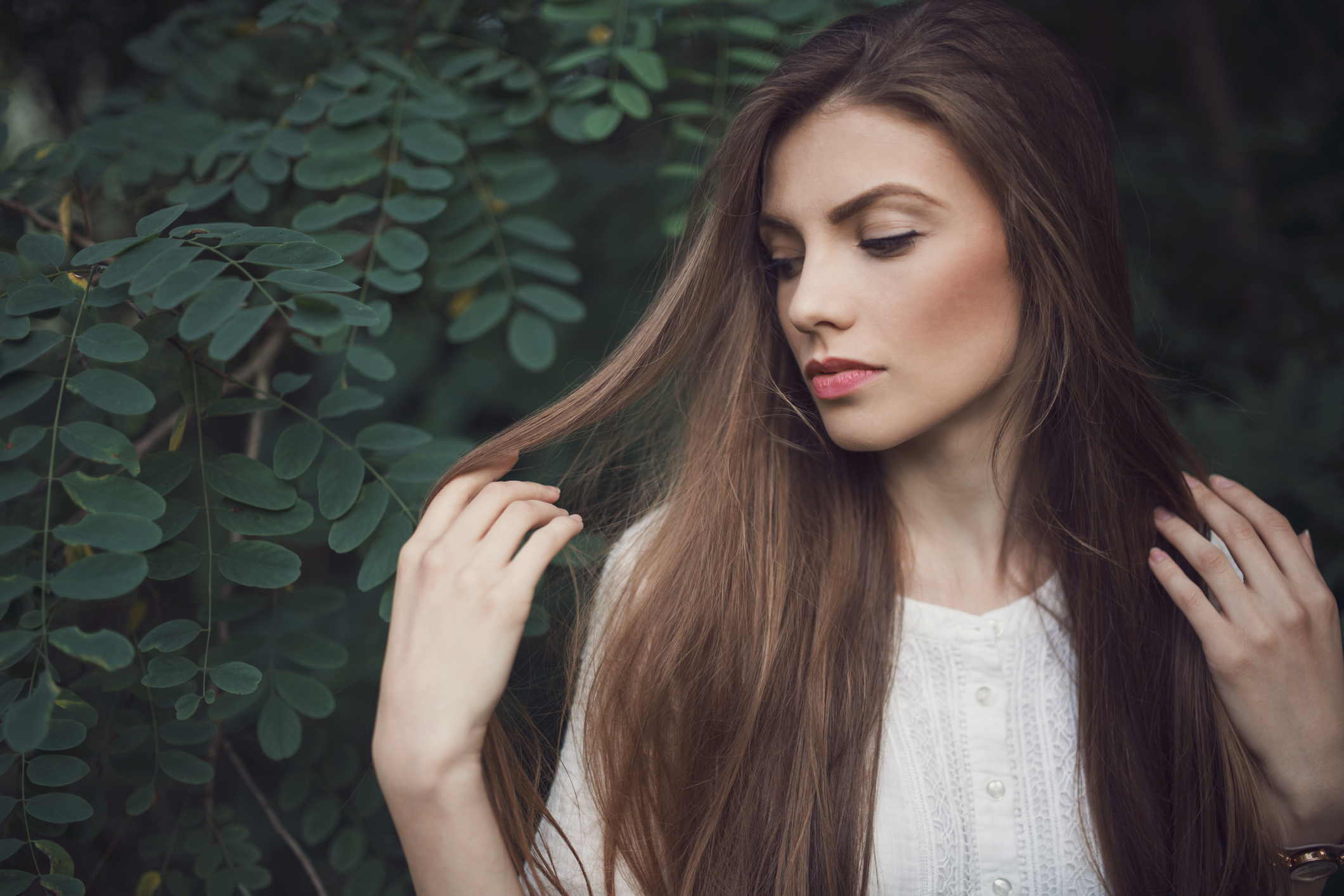 Portrait of a beautiful young woman with a strong healthy hair.