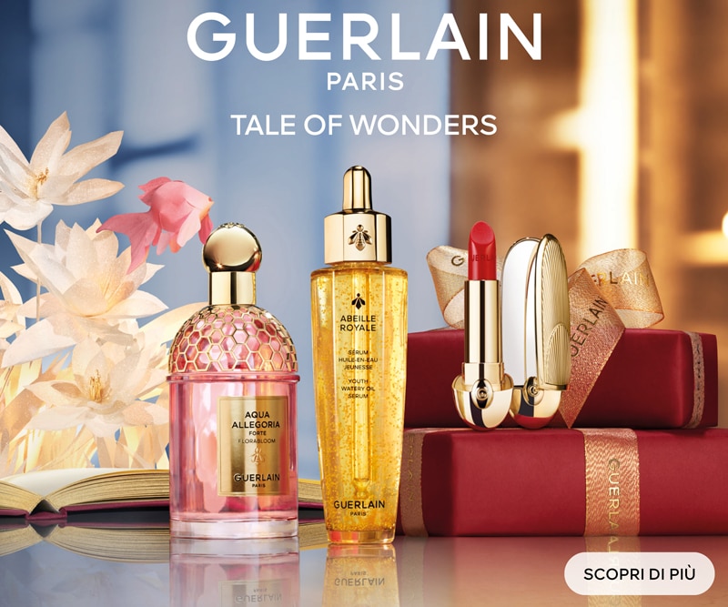 Gift set Guerlain con confezioni rosse e testo Tale of Wonders, pulsante Scopri di più.