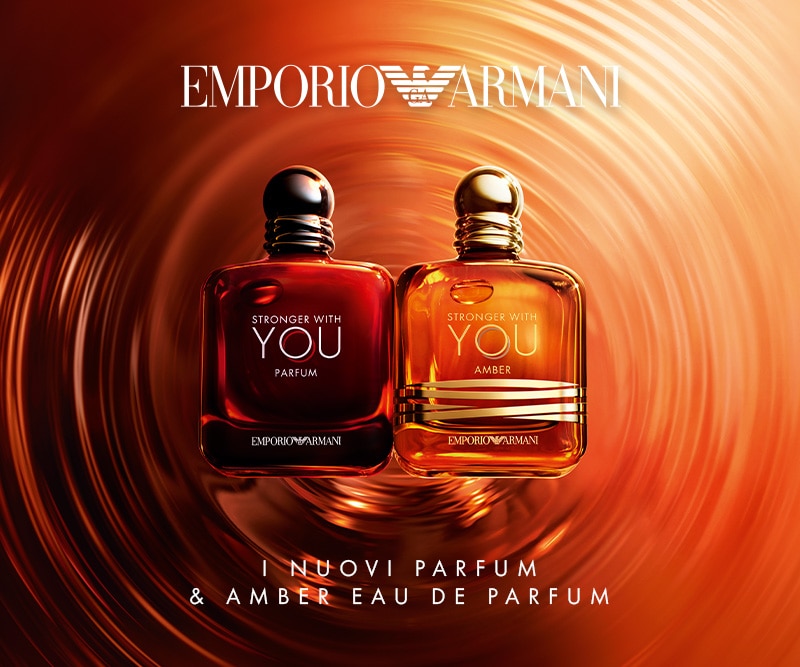 Emporio Armani Stronger With You e Amber, profumi su sfondo arancione vorticoso