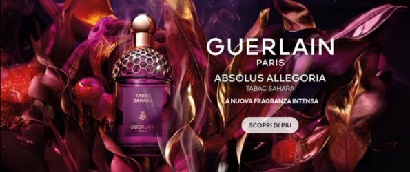 Boccetta del profumo Guerlain Absolus Allegoria Tabac Sahara tra foglie dorate, nuova fragranza intensa.