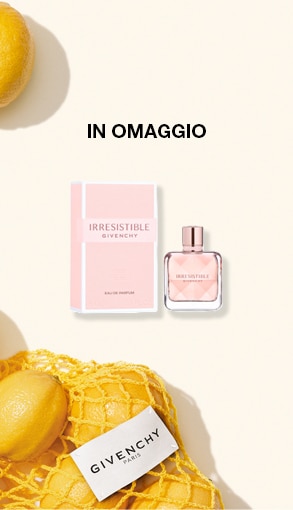 IN OMAGGIO IRRESISTIBLE GIVENCHY, profumo con confezione rosa e flacone abbinato accanto a limoni