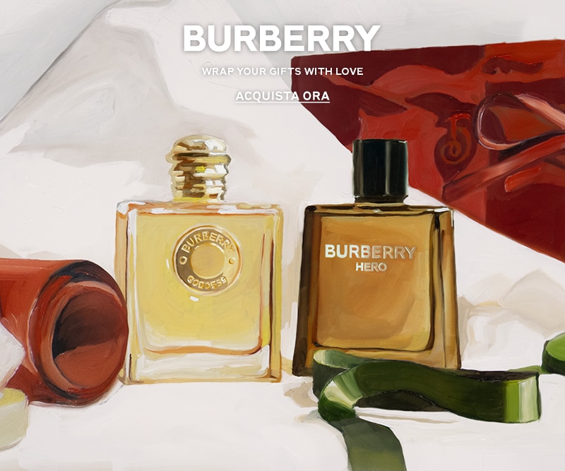MIT2025-WK51-Burberry-HP-Banner.jpg Confezioni regalo eleganti con flaconi Burberry, testo Wrap Your Gifts With Love e pulsante Acquista Ora.