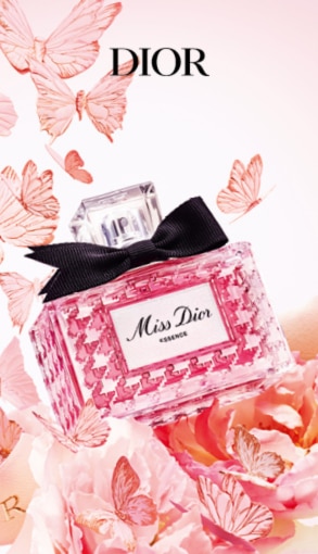 Profumo Miss Dior Essence in flacone rosa con fiocco nero.