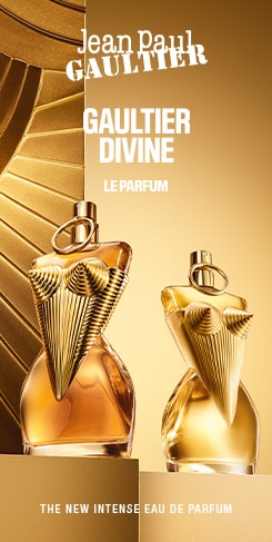 Jean Paul Gaultier Divine Le Parfum - Nuovo Eau de Parfum intenso con flaconi dorati dal design scultoreo su sfondo dorato.