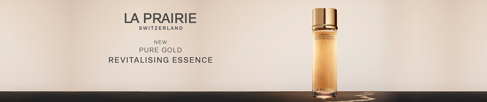 La Prairie Pure Gold Revitalising Essence – Essenza rivitalizzante di lusso con oro puro, confezione elegante con tappo dorato, ideale per la cura della pelle.