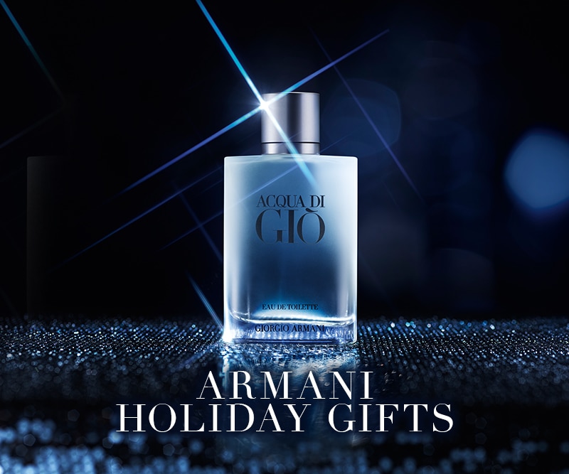 Bottiglia di profumo Armani Acqua di Giò Eau de Toilette su sfondo blu luminoso, idea regalo Natale Giorgio Armani.
