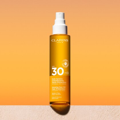 150 ML Clarins HUILE SOLAIRE Olio Solare Illuminante Protezione Alta SPF 30  1 di 5 